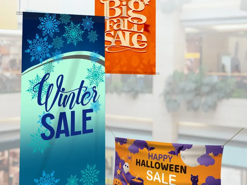 Custom sale banners hanging in a Scottsdale AZ shopping center